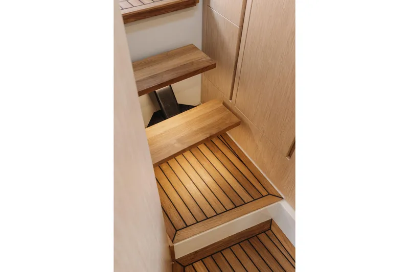  Yacht Photos Pics Wooden interior stairs on the 2026 XO Boats EXPLR 44 yacht.