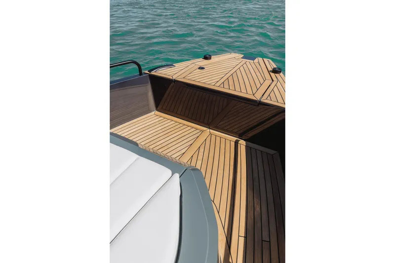  Yacht Photos Pics 2026 XO Boats EXPLR 44 deck with elegant wood finish on calm water.