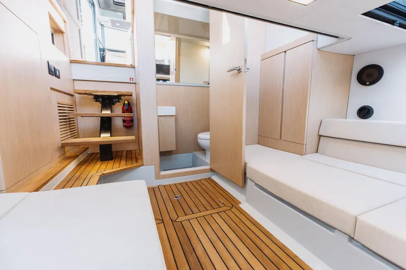  Yacht Photos Pics Interior of 2026 XO Boats EXPLR 44, featuring modern wood finishes and seating.