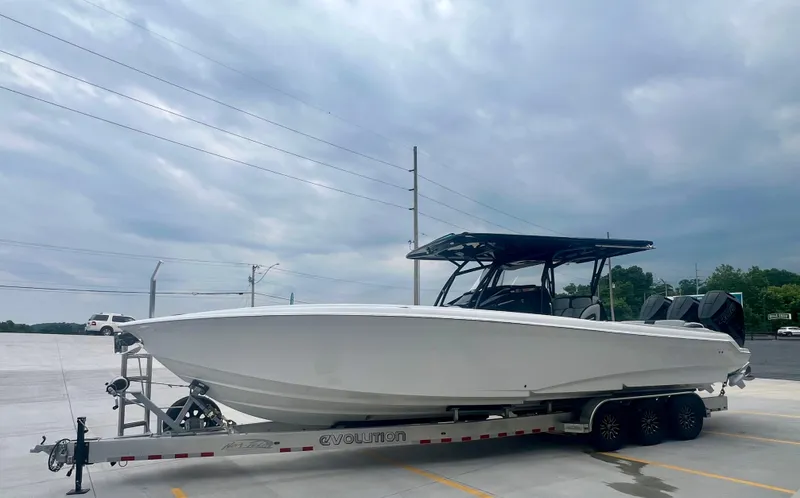  Yacht Photos Pics 2025 Nor-Tech 340 Sport Center Console boat on trailer under cloudy sky.