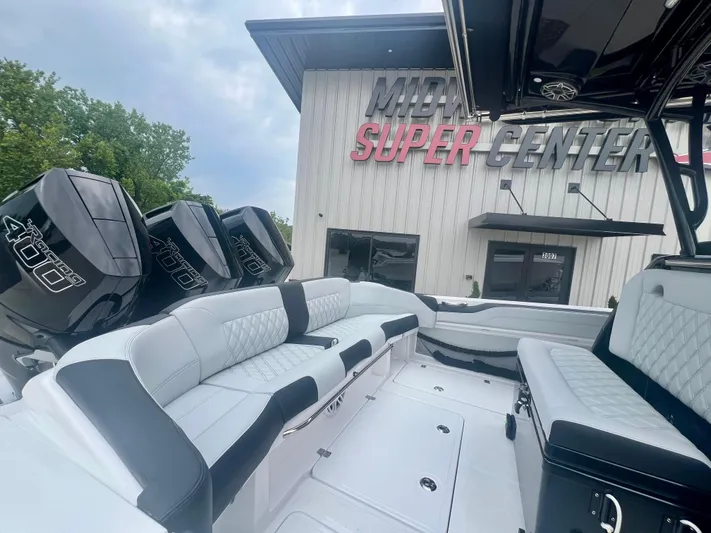  Yacht Photos Pics 2025 Nor-Tech 340 Sport Center Console boat with triple 400 engines at marina.