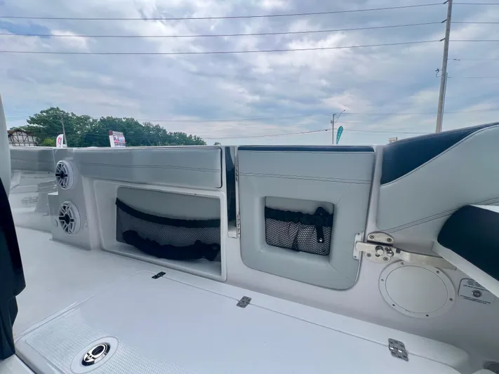  Yacht Photos Pics 2025 Nor-Tech 340 Sport Center Console interior with storage compartments and speakers.