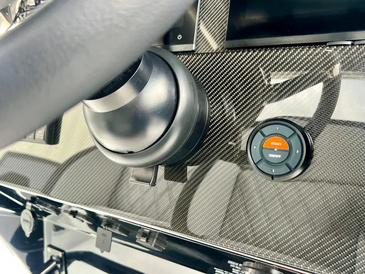  Yacht Photos Pics 2025 Nor-Tech 340 Sport Center Console dashboard with carbon fiber finish and start button.