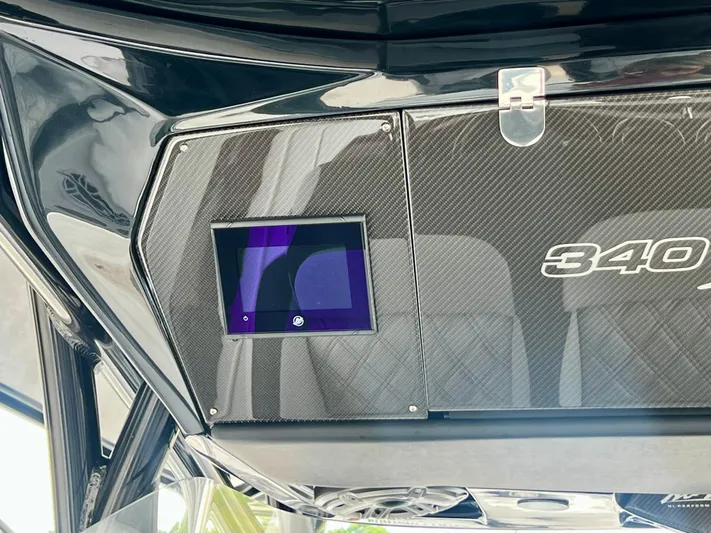  Yacht Photos Pics 2025 Nor-Tech 340 Sport Center Console dashboard with digital display and sleek design.