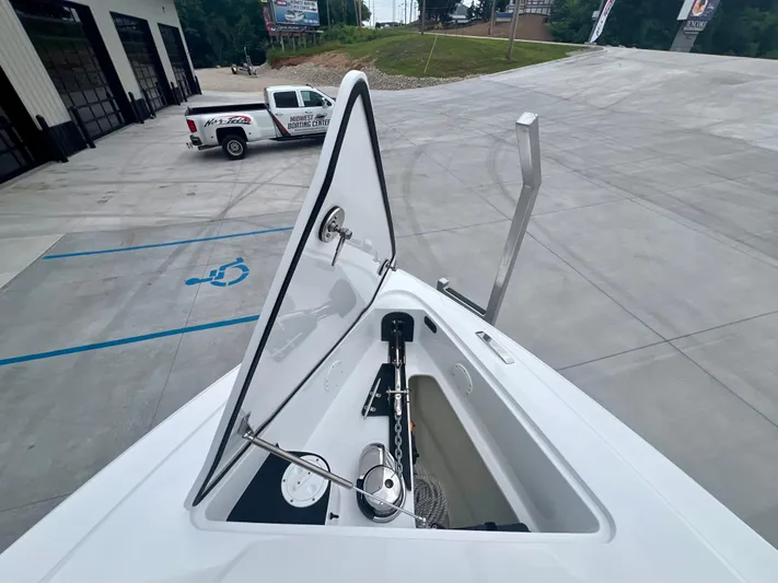  Yacht Photos Pics 2025 Nor-Tech 340 Sport Center Console boat with open anchor compartment.