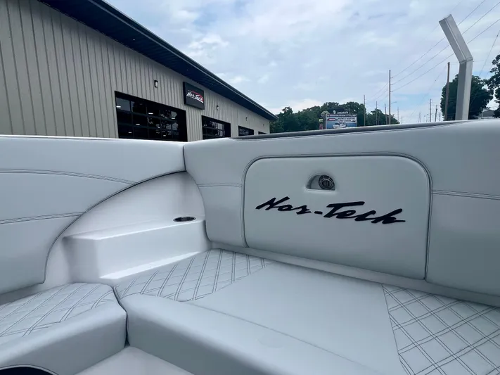  Yacht Photos Pics 2025 Nor-Tech 340 Sport Center Console interior with white seating and logo detail.