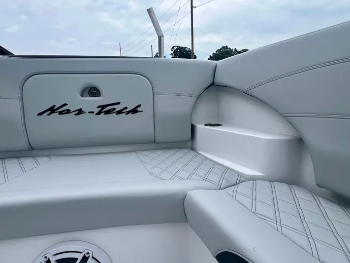  Yacht Photos Pics 2025 Nor-Tech 340 Sport Center Console interior with white seating and logo detail.