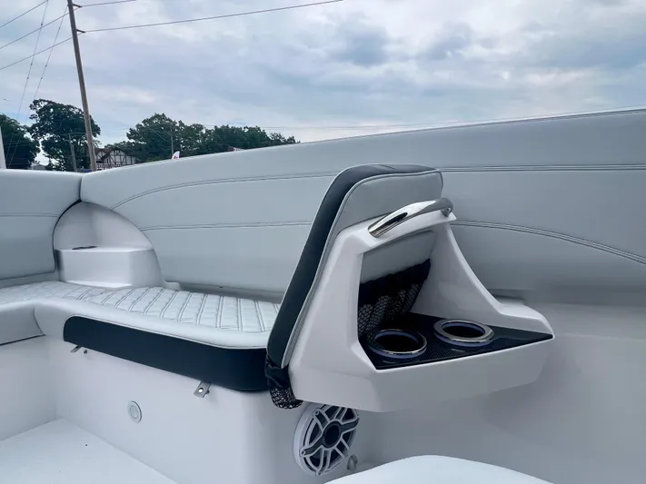  Yacht Photos Pics 2025 Nor-Tech 340 Sport Center Console interior with seating and cup holders.