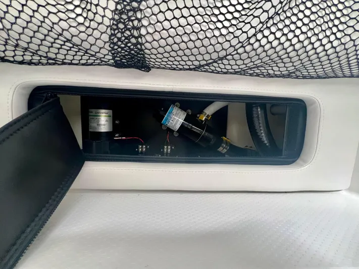  Yacht Photos Pics 2025 Nor-Tech 340 Sport Center Console interior compartment with visible wiring and components.