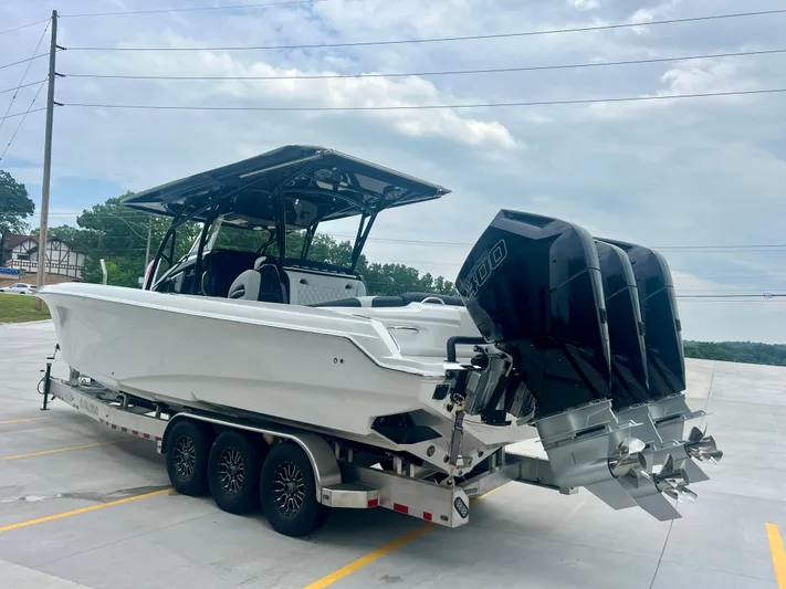  Yacht Photos Pics 2025 Nor-Tech 340 Sport Center Console boat on trailer with triple outboard engines.