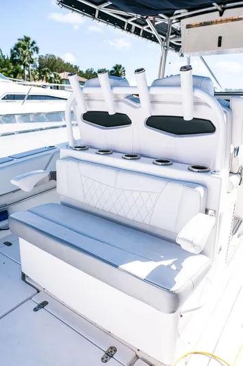  Yacht Photos Pics 2005 Fountain 38 CC Tournament Edition boat seating with rod holders and cup holders.