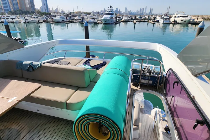  Yacht Photos Pics Luxurious 2019 Princess F62 yacht docked at marina with city skyline view.