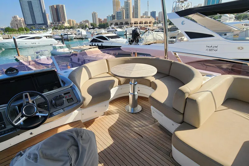  Yacht Photos Pics Luxurious 2019 Princess F62 yacht interior with plush seating and scenic marina view.