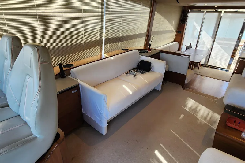  Yacht Photos Pics Luxurious interior of 2019 Princess F62 yacht with elegant seating and dining area.