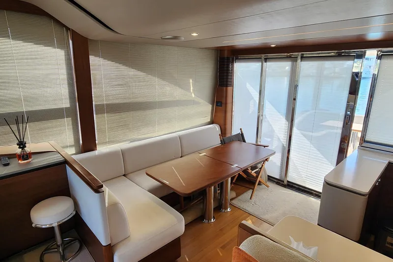  Yacht Photos Pics Luxurious interior of 2019 Princess F62 yacht with elegant seating and dining area.