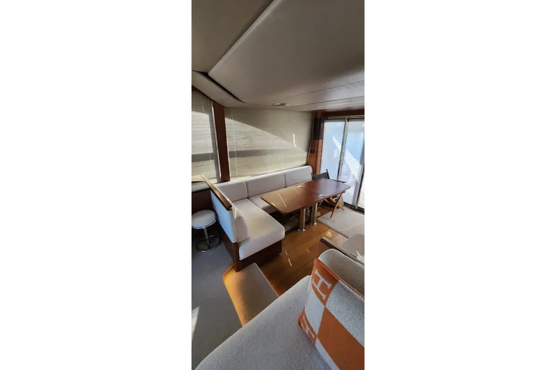  Yacht Photos Pics Luxurious interior of 2019 Princess F62 yacht with elegant seating and dining area.