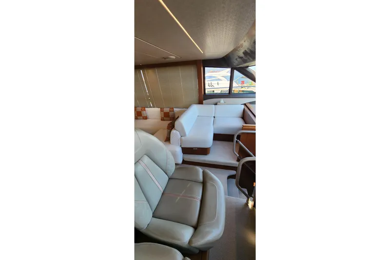  Yacht Photos Pics Luxurious interior of 2019 Princess F62 yacht with elegant seating and modern design.