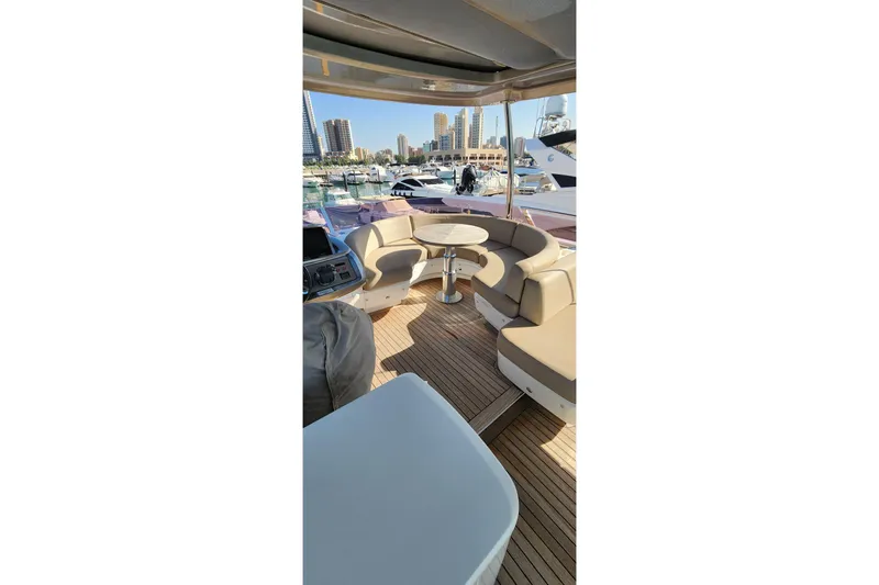  Yacht Photos Pics Luxurious 2019 Princess F62 yacht interior with elegant seating and marina view.