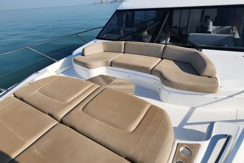  Yacht Photos Pics Luxurious 2019 Princess F62 yacht with spacious outdoor seating and scenic ocean view.