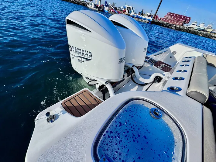 Suadha Yacht Photos Pics Tidewater 320 CC Adventure 2021 with dual Yamaha outboard engines on the water.