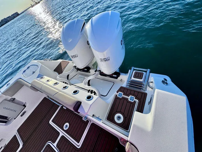 Suadha Yacht Photos Pics Tidewater 320 CC Adventure 2021 boat with twin engines on the water.