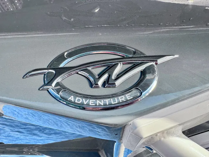 Suadha Yacht Photos Pics Tidewater 320 CC Adventure 2021 logo on a sleek boat surface.