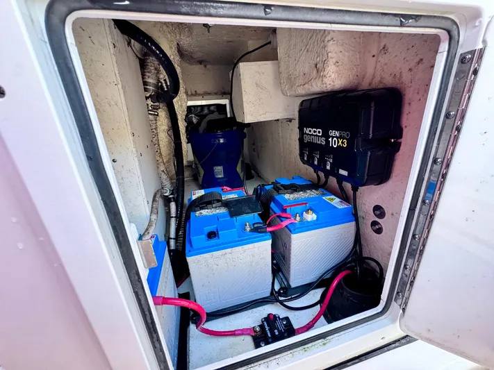 Suadha Yacht Photos Pics 2021 Tidewater 320 CC Adventure boat battery compartment with NOCO Genius charger.