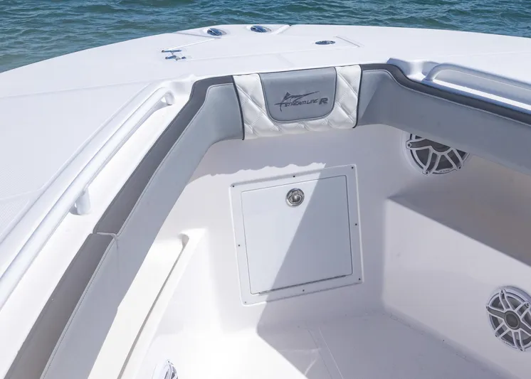  Yacht Photos Pics 2025 Streamline R 35 boat interior with storage compartment and speakers, on calm water.