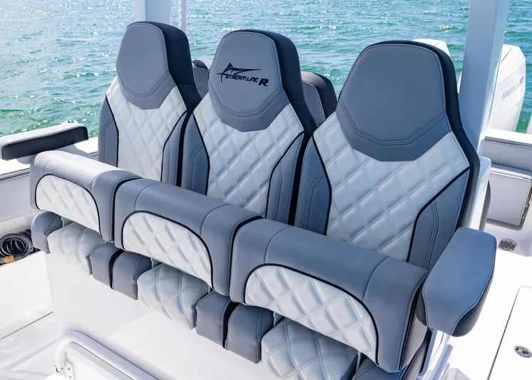  Yacht Photos Pics Luxurious seating on 2025 Streamline R 35 boat, featuring quilted design and ocean backdrop.