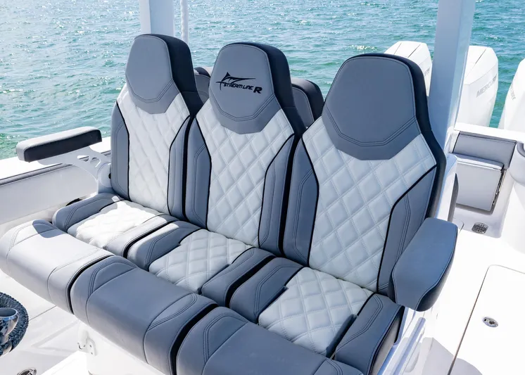  Yacht Photos Pics Luxurious seating on 2025 Streamline R 35 boat with quilted design and ocean backdrop.