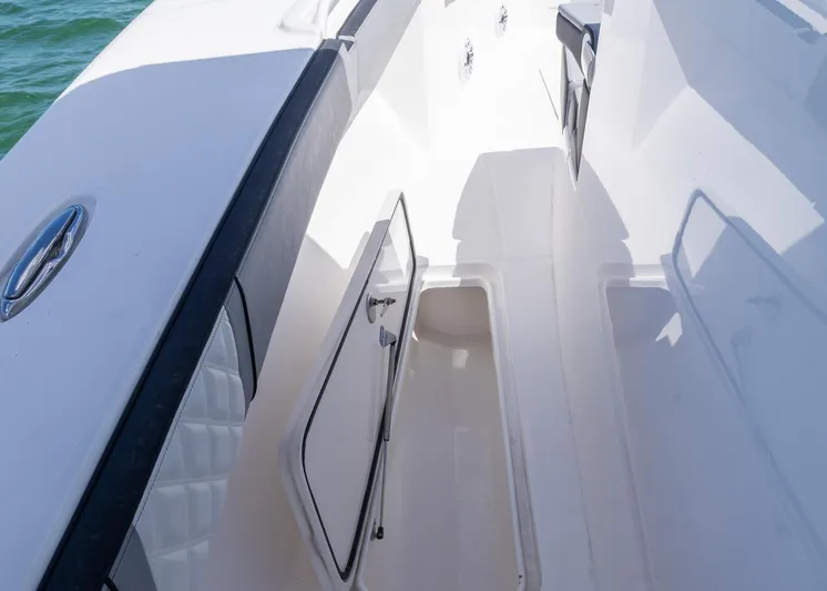  Yacht Photos Pics 2025 Streamline R 35 boat interior with open storage compartment, sleek white design.