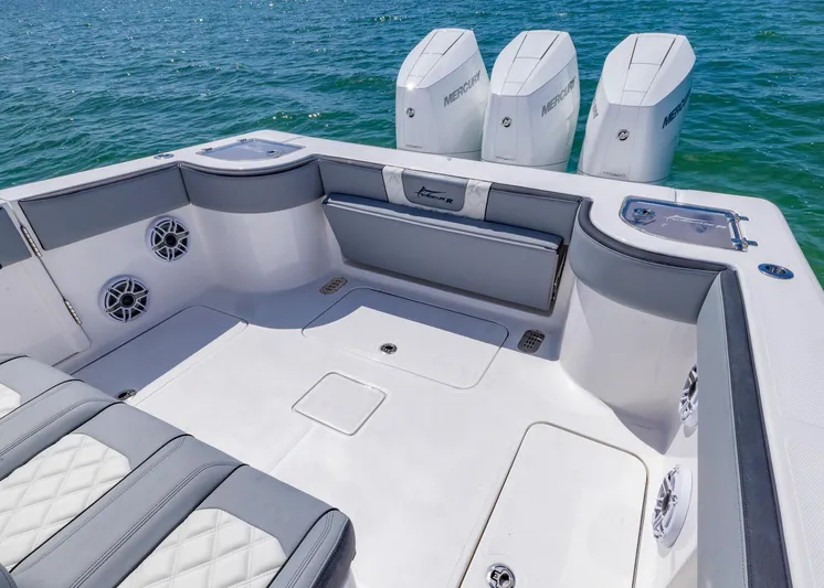  Yacht Photos Pics Luxurious 2025 Streamline R 35 boat interior with seating and triple outboard motors.