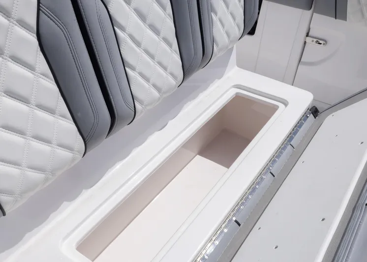  Yacht Photos Pics Luxurious seating and storage on 2025 Streamline R 35 boat, featuring quilted upholstery.