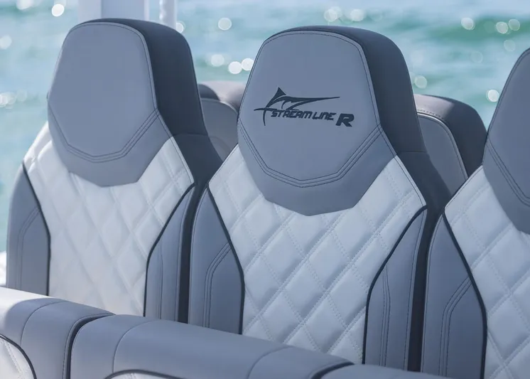  Yacht Photos Pics 2025 Streamline R 35 boat seats with quilted design, set against a backdrop of water.