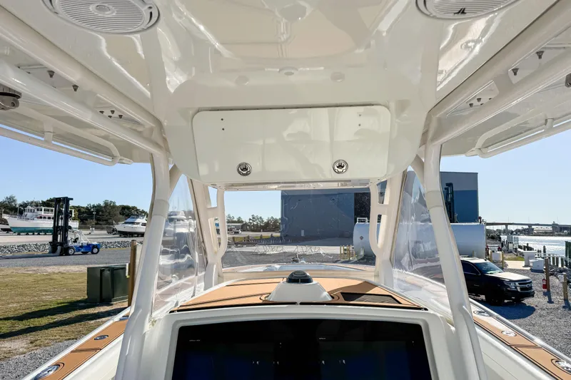  Yacht Photos Pics 2012 Yellowfin 39 Offshore boat interior view with clear skies and marina background.