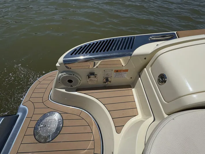 Yacht Photos Pics 2023 Chris-Craft Launch 31 GT boat deck with teak flooring and water view.