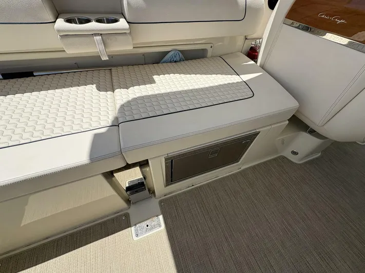  Yacht Photos Pics 2023 Chris-Craft Launch 31 GT interior seating with storage and cup holders.