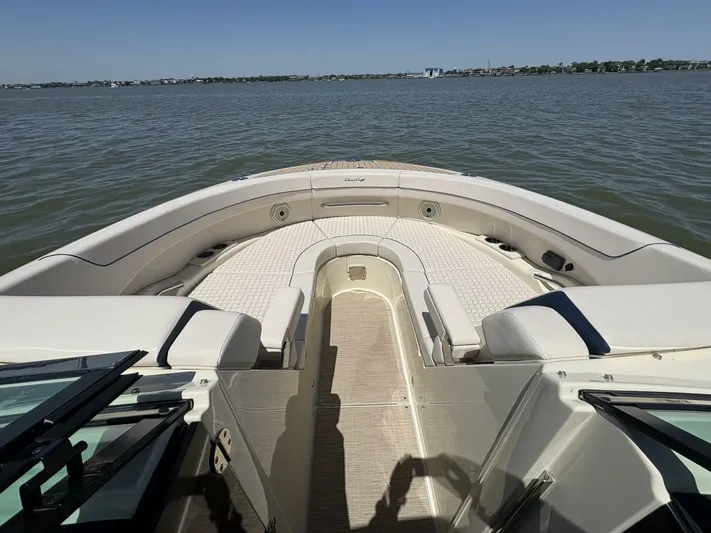  Yacht Photos Pics 2023 Chris-Craft Launch 31 GT boat interior with spacious seating on calm water.