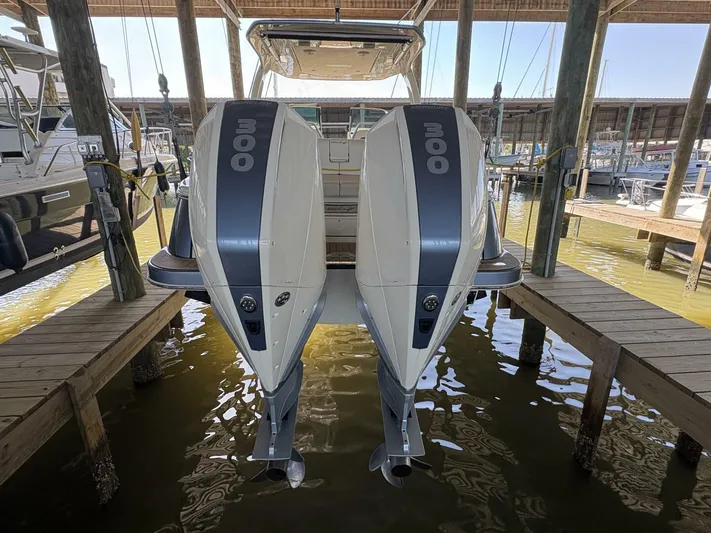  Yacht Photos Pics 2023 Chris-Craft Launch 31 GT with dual outboard engines docked in a marina.
