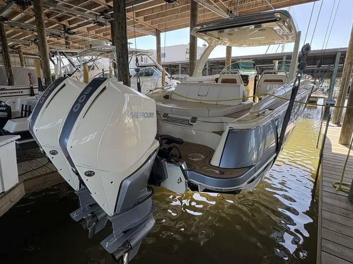  Yacht Photos Pics 2023 Chris-Craft Launch 31 GT boat with dual Mercury engines docked in a marina.