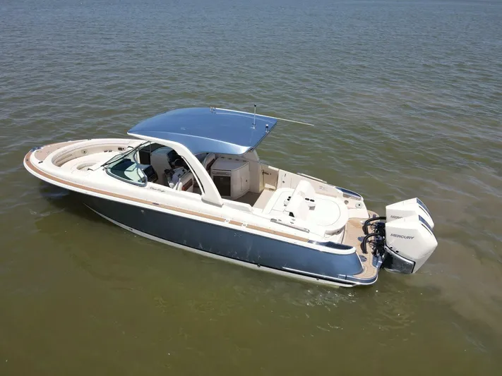  Yacht Photos Pics 2023 Chris-Craft Launch 31 GT boat on calm water, featuring sleek design and modern amenities.