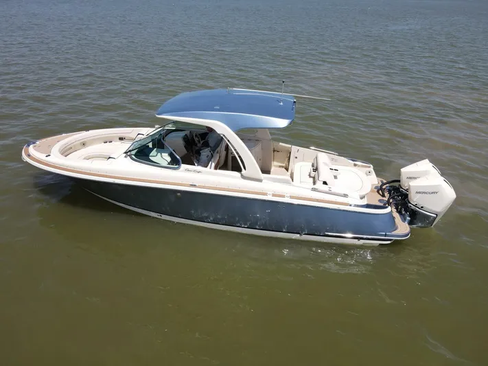  Yacht Photos Pics 2023 Chris-Craft Launch 31 GT boat on calm water, featuring sleek design and modern amenities.