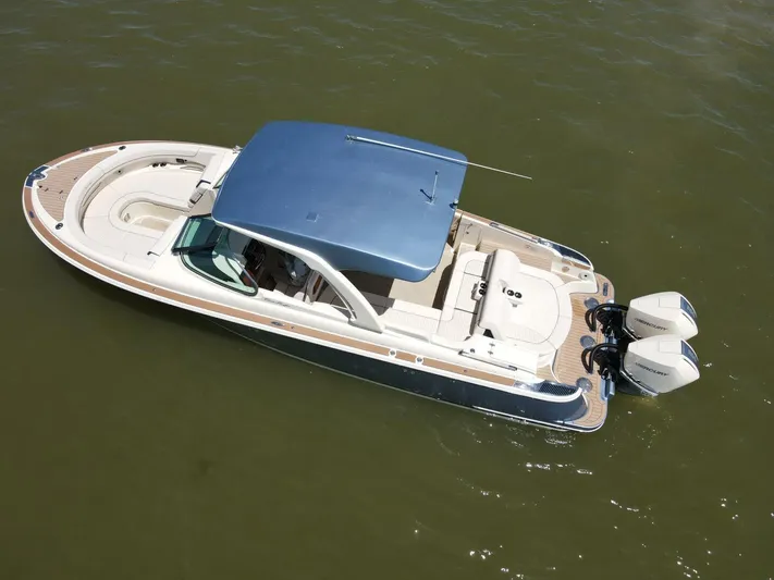  Yacht Photos Pics 2023 Chris-Craft Launch 31 GT boat with dual engines on calm water.