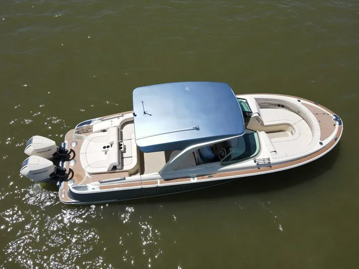  Yacht Photos Pics 2023 Chris-Craft Launch 31 GT boat on water, featuring sleek design and dual outboard engines.