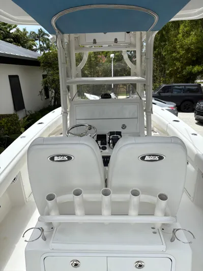  Yacht Photos Pics Center console of a 2019 Young 27 boat with dual seats and rod holders.