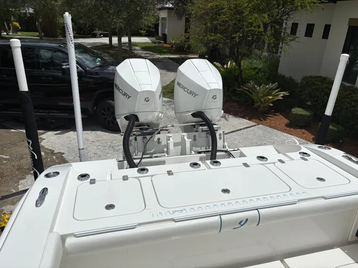  Yacht Photos Pics Rear view of a 2019 Young 27 boat with dual Mercury outboard engines.