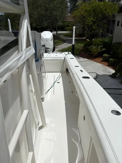  Yacht Photos Pics White 2019 Young 27 boat deck with clean, spacious layout and visible outboard motor.