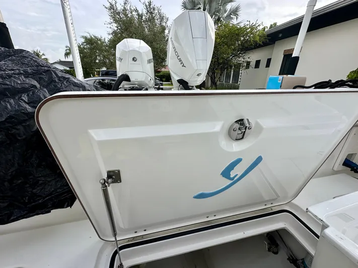  Yacht Photos Pics Boat storage compartment with Mercury outboard motors, Young 27 model, 2019.