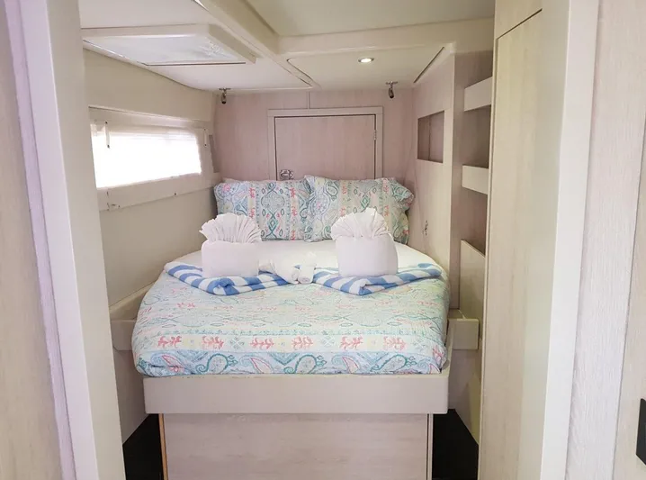 Dash Away Yacht Photos Pics Cozy bedroom in 2015 Leopard 51 Powercat with patterned bedding and decorative towels.