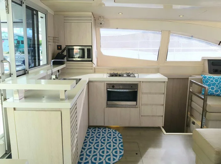 Dash Away Yacht Photos Pics Modern kitchen interior of 2015 Leopard 51 Powercat yacht with sleek design and appliances.